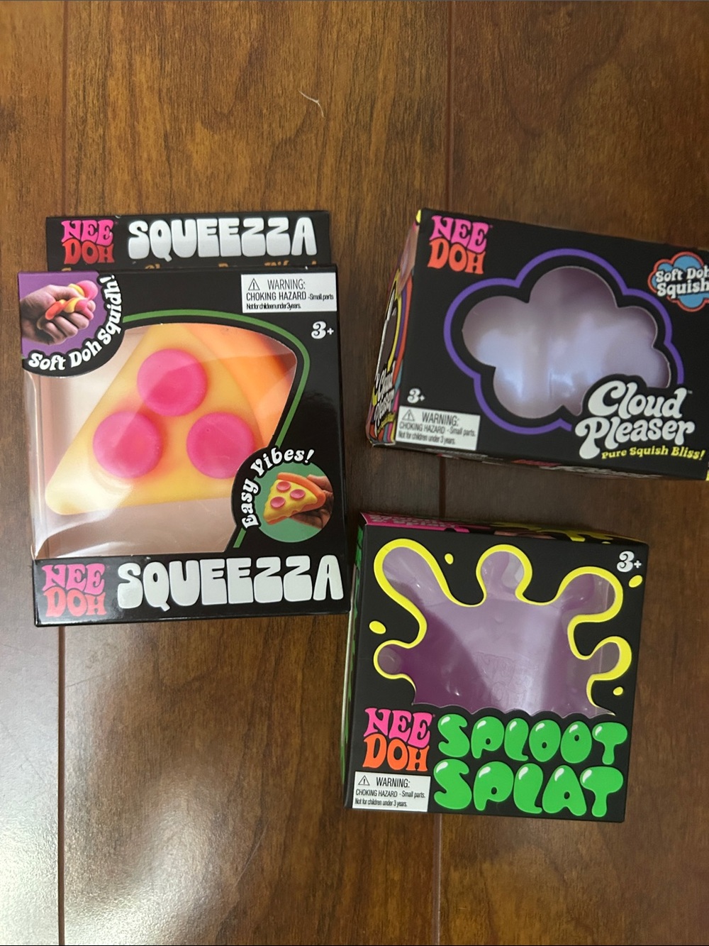3 Nee Doh Squeezies.   Pizza Squezza, Cloud Pleaser and Pink Sploot Splat.